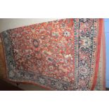 LARGE PREDOMINANTLY RED GROUND CARPET WITH VARIOUS FLORAL AND ANIMAL DECORATION, SIZE APPROX 217 X