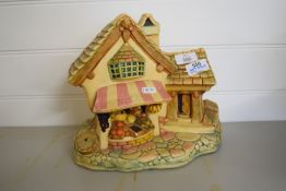 SMALL RESIN FEATURE MODEL OF A COTTAGE, APPROX 26CM HIGH