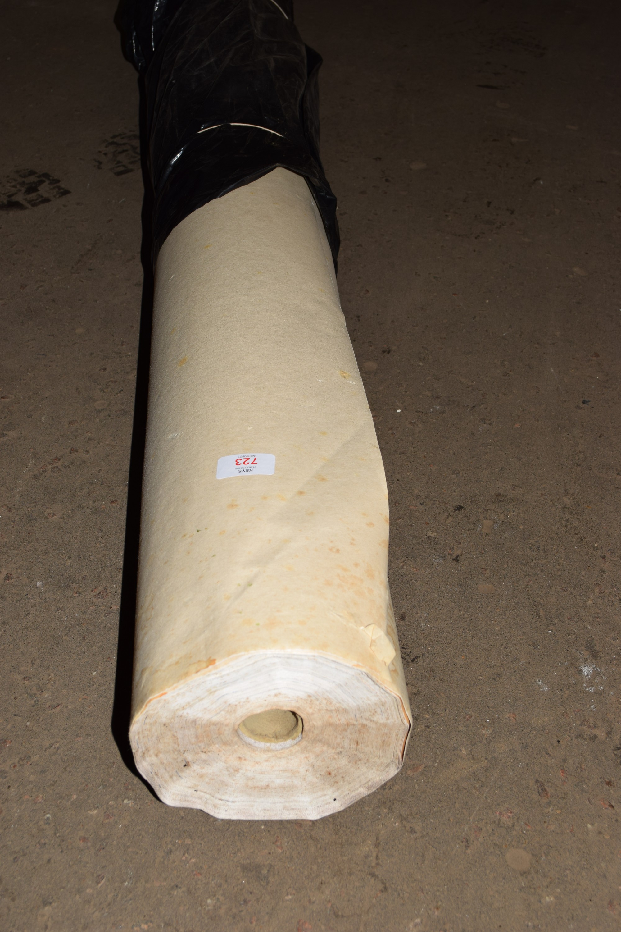 ROLL OF PLASTIC BACKED LINER MATERIAL