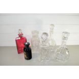 CUT GLASS DECANTERS INCLUDING ONE RED GLASS AND FURTHER SMALL DARK GLASS JAR WITH BIBA MOTIF