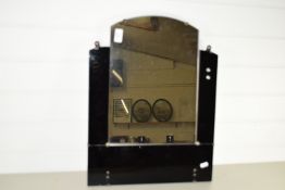 MIRROR MOUNTED ON A BLACK GLASS BACKGROUND