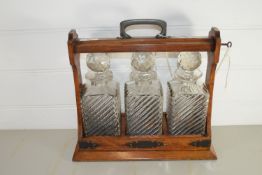 TANTALUS WITH THREE DECANTERS (KEY PRESENT)