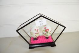 TWO PAINTED EGGS IN GLASS BOX