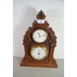 CASED CLOCK AND BAROMETER IN CARVED FRAME