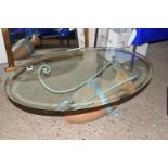 GLASS TOPPED COFFEE TABLE WITH WROUGHT IRON SUPPORTS INCORPORATING A GREEK STYLE AMPHORA