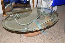 GLASS TOPPED COFFEE TABLE WITH WROUGHT IRON SUPPORTS INCORPORATING A GREEK STYLE AMPHORA