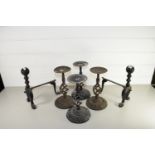 PAIR OF FIRE DOGS AND FOUR METAL CANDLE HOLDERS