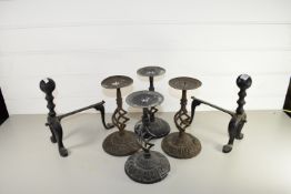 PAIR OF FIRE DOGS AND FOUR METAL CANDLE HOLDERS