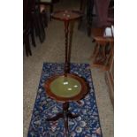 LEATHER TOPPED WINE TABLE, APPROX 36CM DIAM MAX TOGETHER WITH A SIMILAR TORCHERE