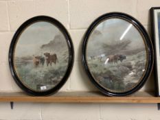 TWO PRINTS OF HIGHLAND CATTLE WATERING IN OVAL BLACK AND GILT FRAMES