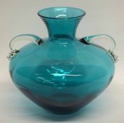 Murano type green glass vase, the globular body with two handles, 24cm high