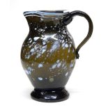 Small Nailsea glass jug, the olive green ground with a trailing white design, possibly late 18th