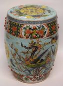 Chinese porcelain garden seat, the green ground decorated in polychrome with foliage and flowers and