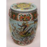 Chinese porcelain garden seat, the green ground decorated in polychrome with foliage and flowers and