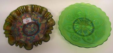 Two pieces of carnival glass bowls, with floral designs, one green ground, the other with a grape