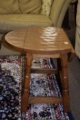 Small oak rustic jointed folding oval table, approx 59 x 59cm