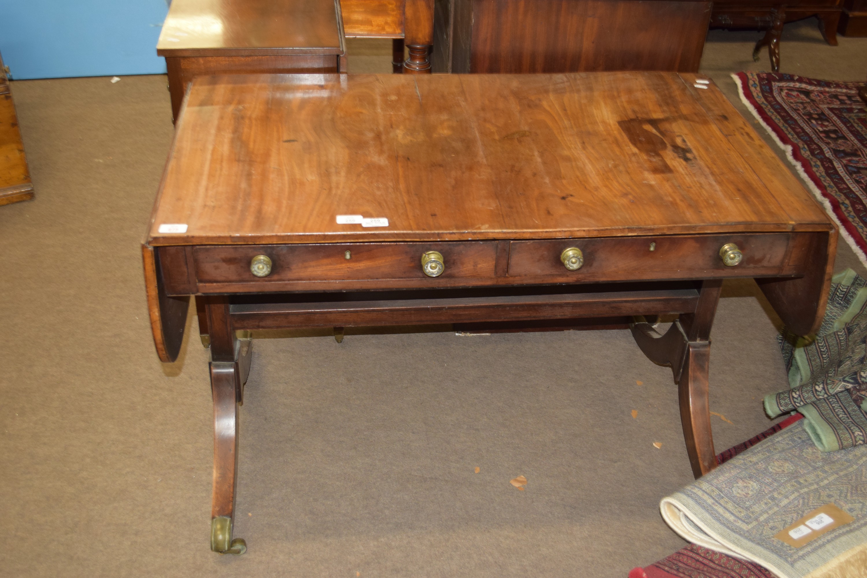 19th century mahogany sofa table of typical form with two drawers beneath, width approx 105cm