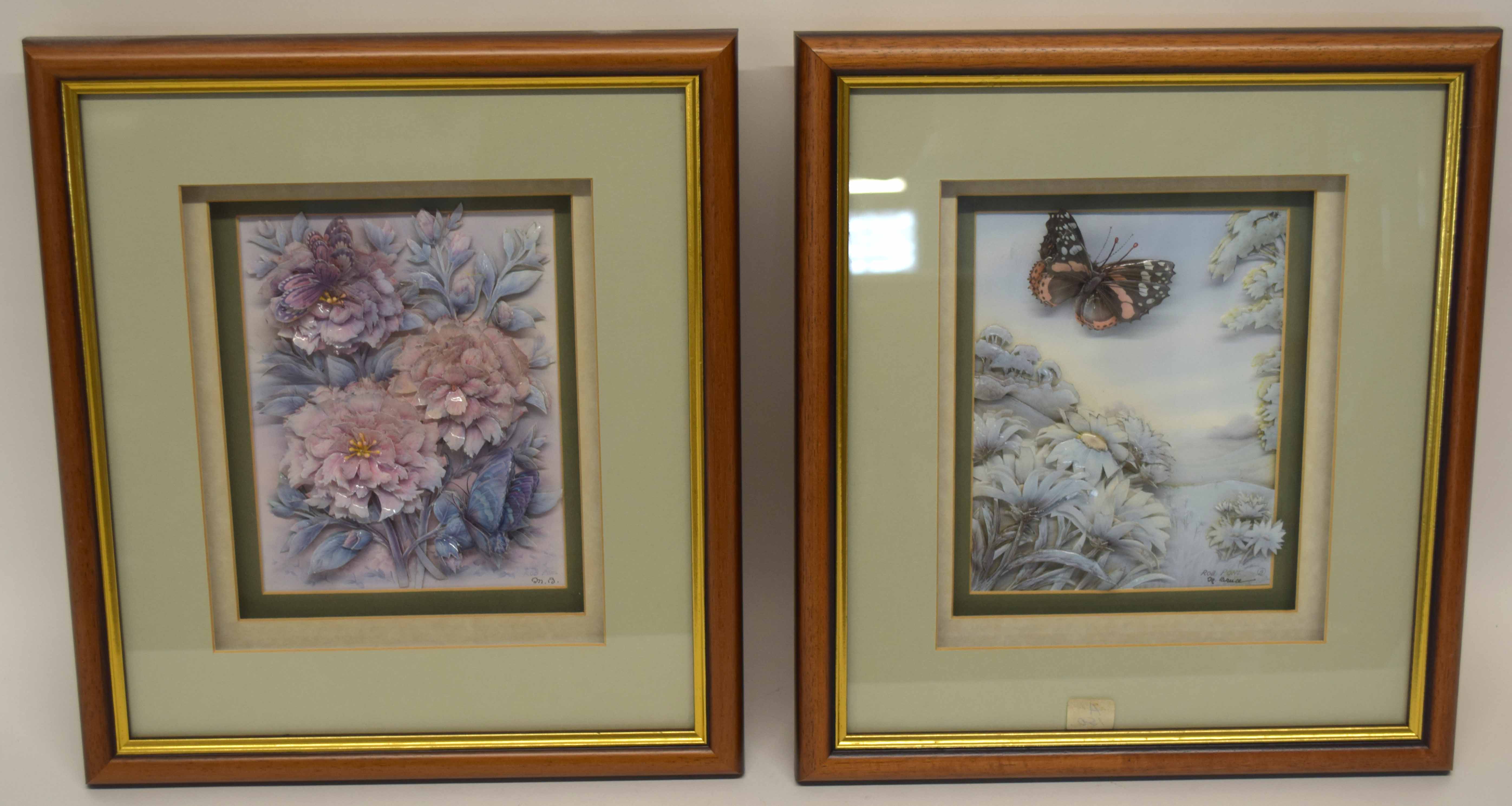 Two framed pictures, one of porcelain flowers in relief, the other of butterfly and foliage, both in