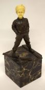 Reproduction Art Deco figure of a skier on onyx or marble base, the head modelled in resin, 30cm