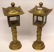 Pair of Oriental table lamps in brass, decorated with dragons in relief with brass covers, similarly