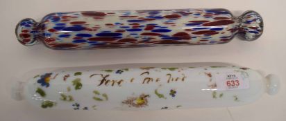 Two glass rolling pins, one with floral design with indistinct inscription, further pin with a