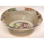 Late 18th century Chinese porcelain chestnut basket, the interior decorated in polychrome with