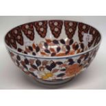 Oriental bowl decorated in iron red and black with flowers, 25cm diam