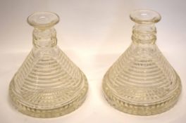 Two unusual glass candlesticks with ridged design and star cut to base, 17cm high (2)