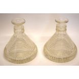 Two unusual glass candlesticks with ridged design and star cut to base, 17cm high (2)