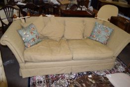 20th century Knole style two/three seater settee upholstered in beige fabric, having rope tied