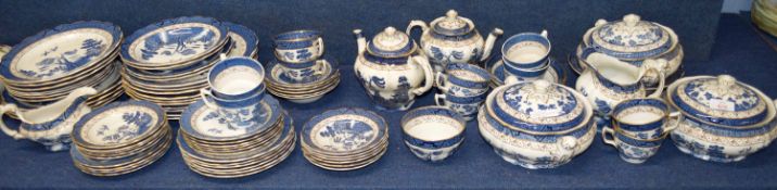 Extensive quantity of dinner wares by Booths in the Real Old Willow Pattern comprising three tureens