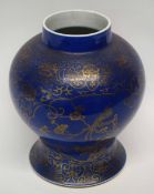 19th century Chinese porcelain jar, the blue ground decorated in gilt with birds on branches amongst