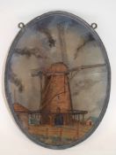 Oval glass wall plaque depicting a windmill