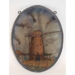 Oval glass wall plaque depicting a windmill