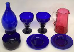 Quantity of blue coloured glass together with a ruby coloured jug, the blue ground glass