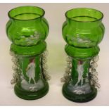 Two green glass vases, both painted with Mary Gregory type designs of children, (2), 18cm high