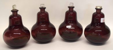 Group of four ruby coloured glass chemists jars, globular shape, with stoppers, (4)