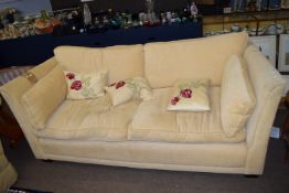 Mark Elliot cream fabric covered three-seater settee with four removable cushions and five