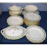 Quantity of dinner wares made by Cauldon with a gilt design with green borders, with monogram to