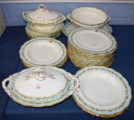 Quantity of dinner wares made by Cauldon with a gilt design with green borders, with monogram to