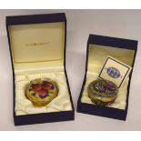 Enamel box and paperweight by Moorcroft in original boxes, one decorated with pomegranates, the oth