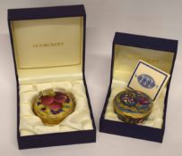 Enamel box and paperweight by Moorcroft in original boxes, one decorated with pomegranates, the oth
