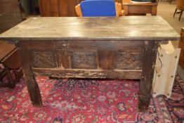 17th/18th century and later oak blanket box raised on stile legs with carved panel and planked