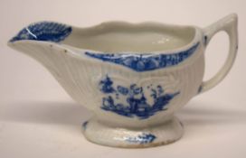 Small Lowestoft porcelain cream boat, the fluted sides decorated in underglaze blue with fishermen