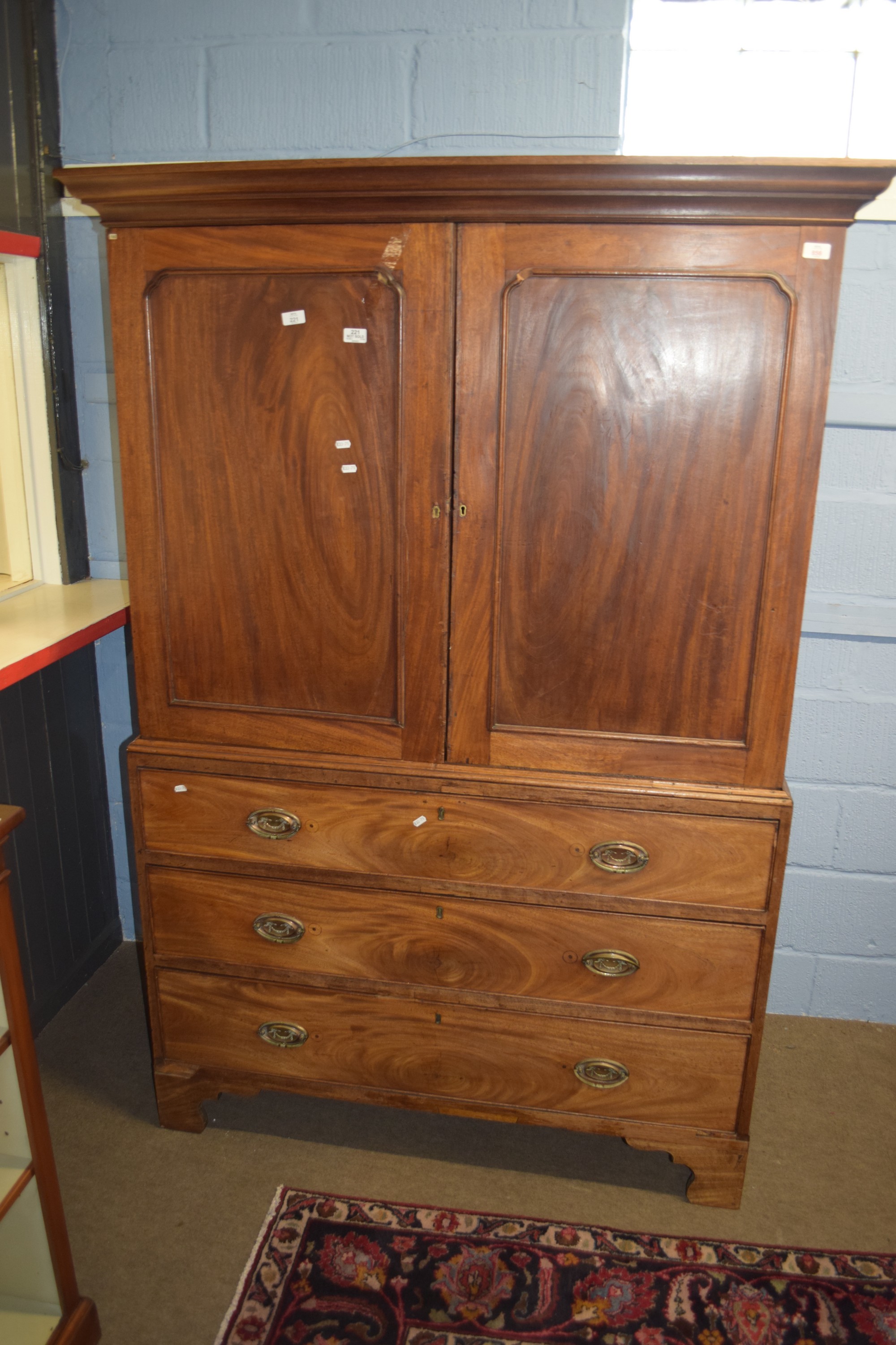 19th century mahogany converted linen press, two panel doors over three full width graduated drawers