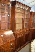 Full height mahogany side cabinet with glazed bookcase raised over double cupboard, width approx