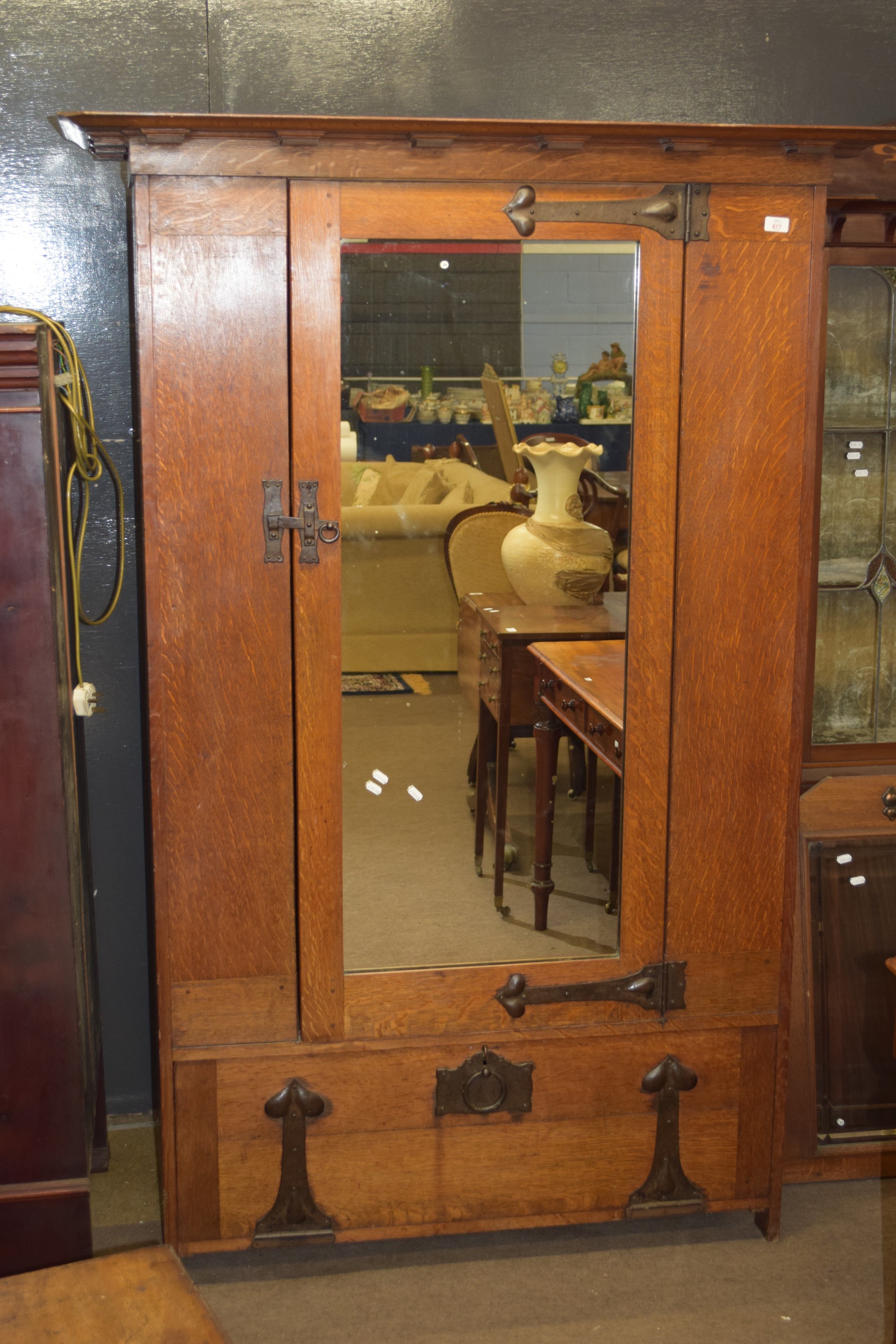 Early 20th century oak single wardrobe in the Arts & Crafts manner by Heal & Son, Tottenham Court
