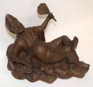 Bronze figure of a recumbent Oriental man
