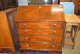 Early 19th century mahogany drop front bureau raised on bracket feet, the fitted fall front interior