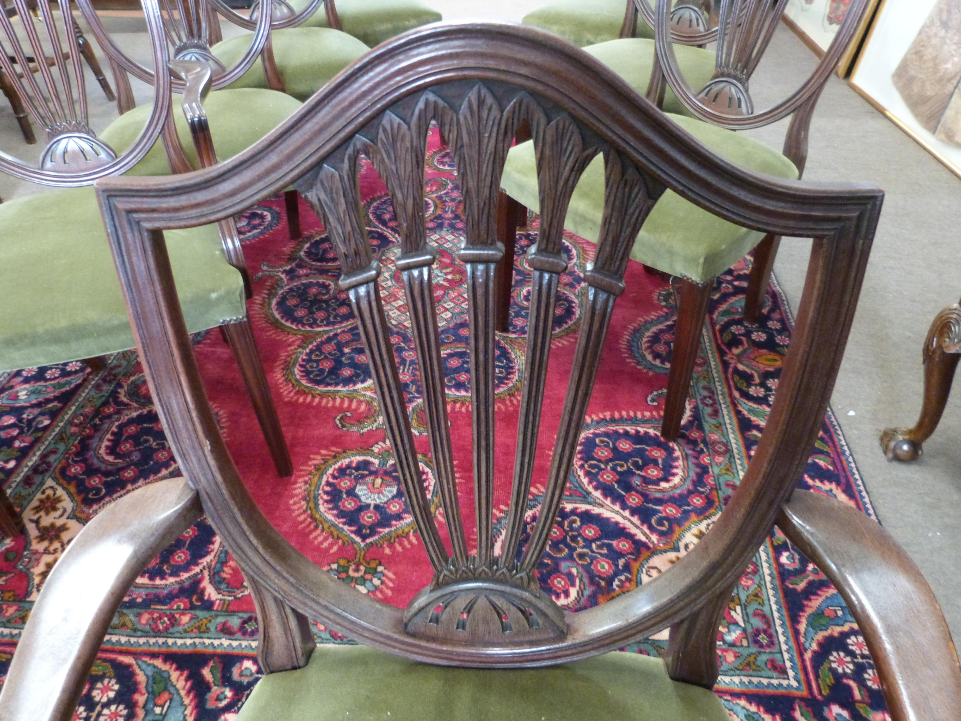 Set of 8 19th century shield back upholstered dining chairs with carved decoration. - Image 3 of 3